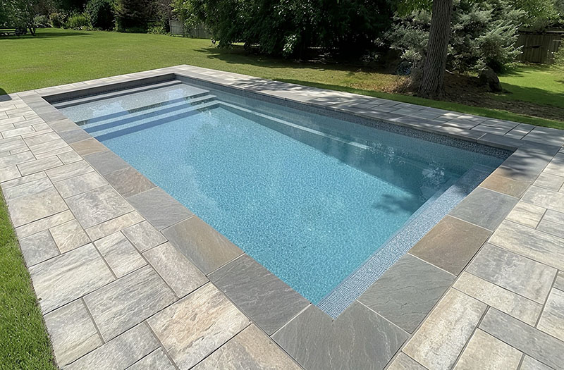 final pool installation completed backyard