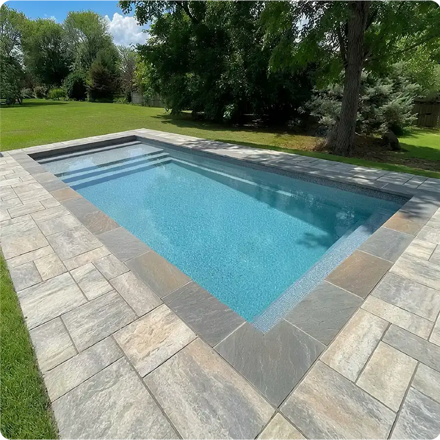Installed Granita™ Fiber pool — outdoor living space ready