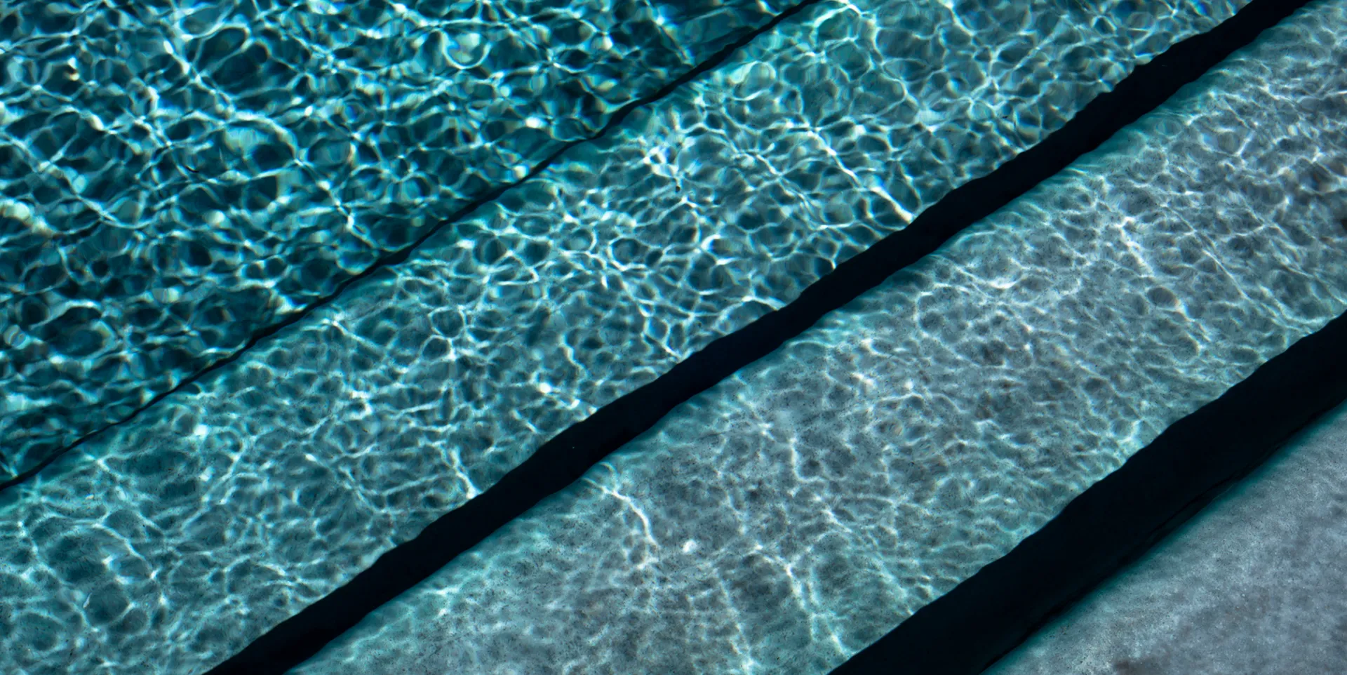 Granita™ Technology — fiberglass pool with mineral finish