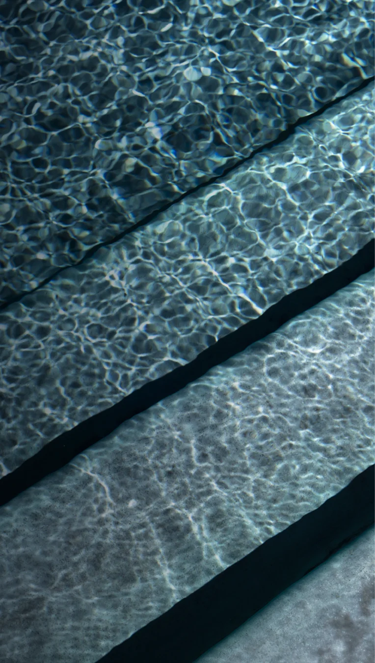 Granita™ Technology — fiberglass pool with mineral finish