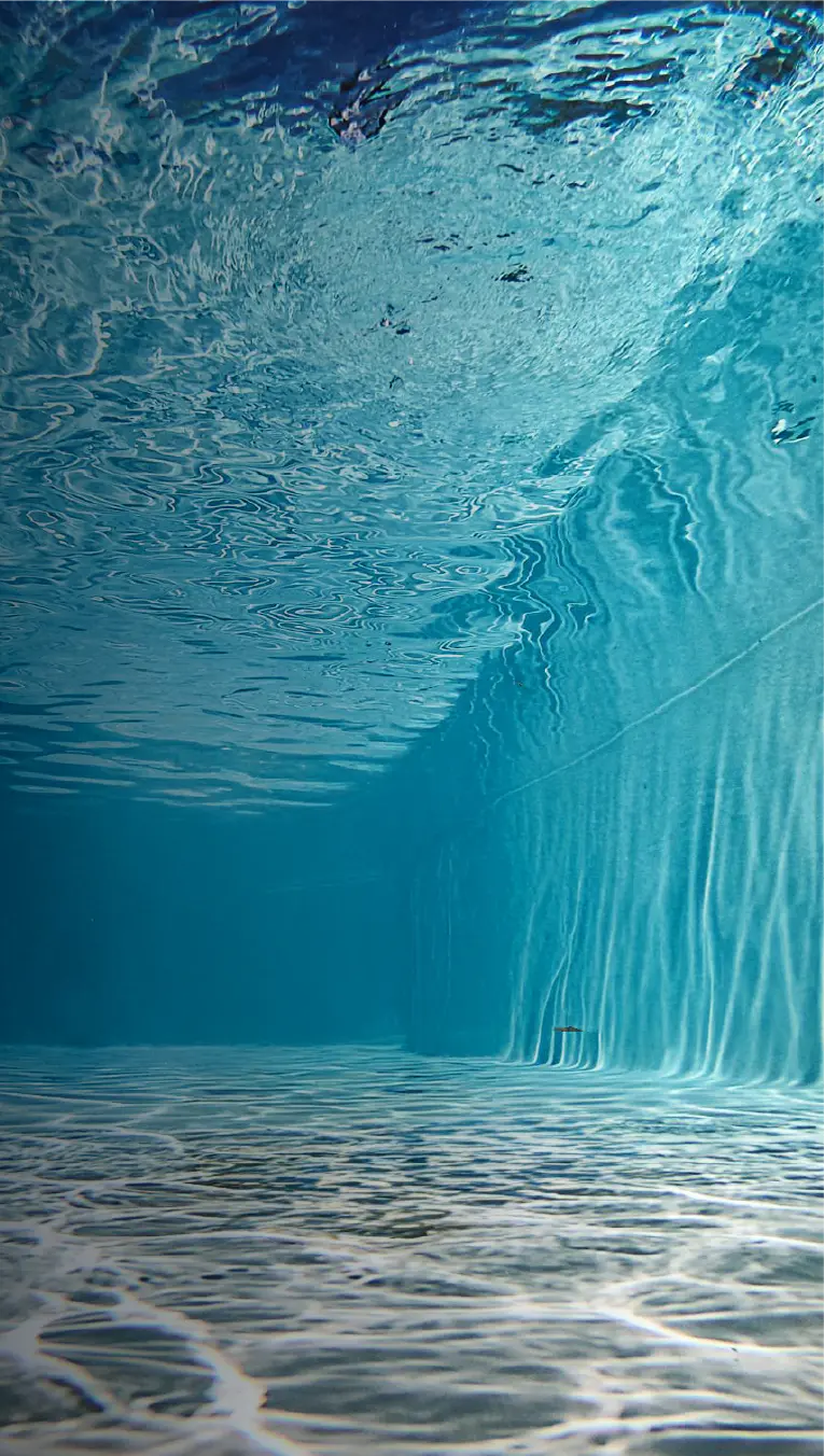 Interior view of a Granita™ pool with crystal-clear water